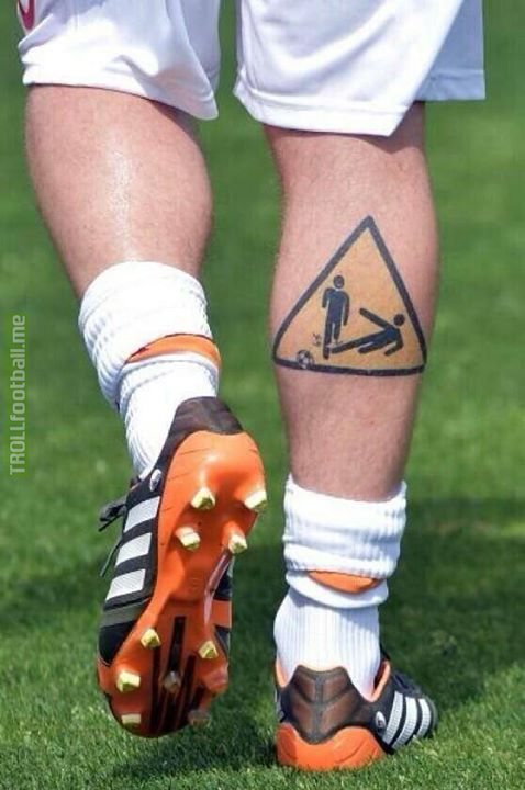 De Rossi's "Beware of getting tackled" tattoo...