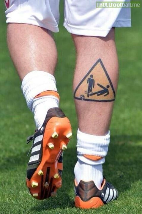 De Rossi's "Beware of getting tackled" tattoo...