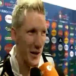 Moment when Spain celebrate their Euro 2008 triumph right behind Schweinsteiger, who is in a post-match interview