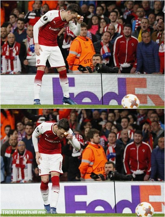 Atletico Madrid fans threw bread at Mesut Özil. He picked it up, touched it to his forehead and laid it to the side as it's against his religion and culture to waste bread.   Classy response.