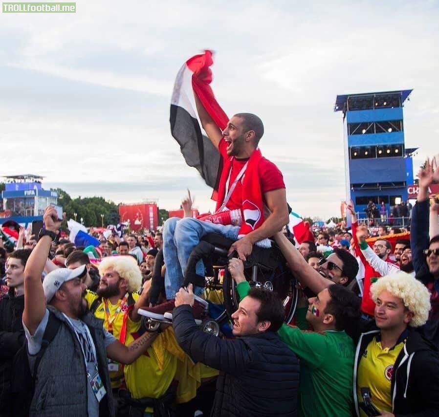 Mexico and Colombia fans lifted an Egyptian supporter so he could see his country’s match.