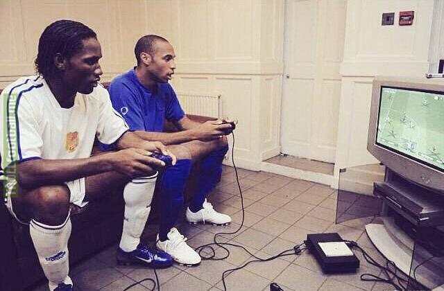 Drogba and Henry playing PES on PS2