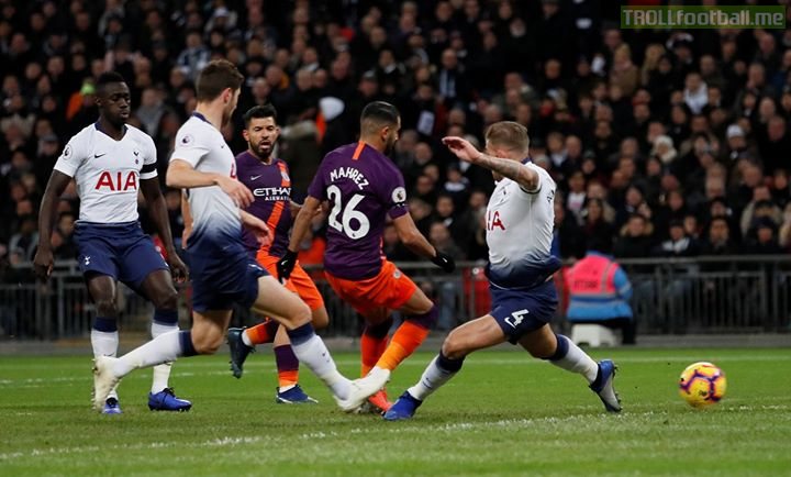 Riyad Mahrez's solitary first-half goal continues Manchester City's unbeaten run, sending them back to the top of the table against Spurs