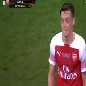 Mesut Ozil walking off the pitch after being subbed.