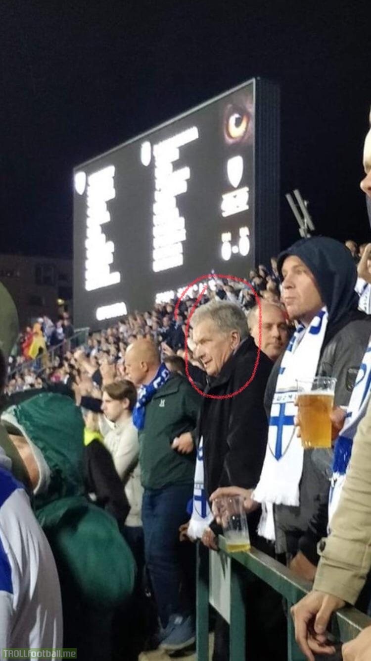 President of Finland, Sauli Niinistö casually watching the match against italy among the ultras.