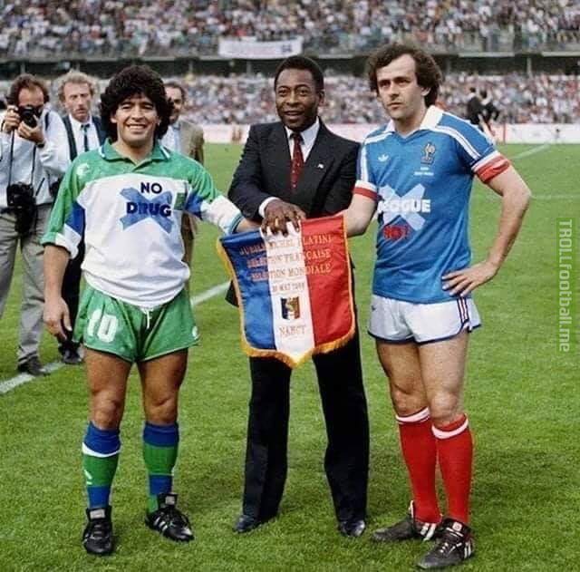This picture from 1986. Platini wears a shirt saying "no corruption", Maradona wears one saying "no drugs"