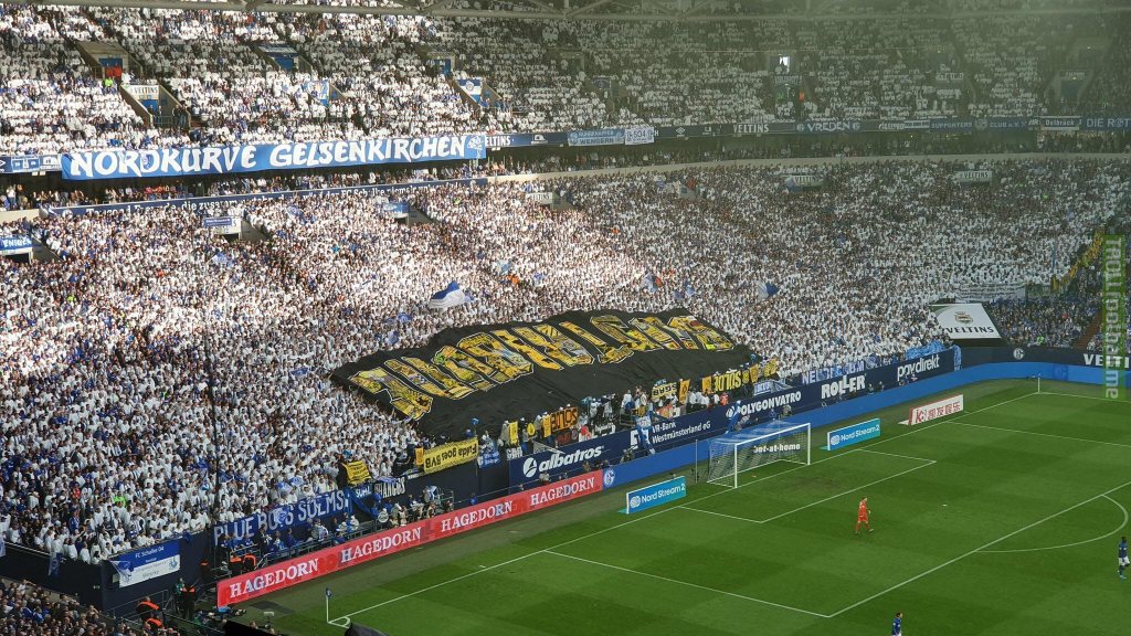 Schalke 04 fans with massive stolen Borussia Dortmund banner
