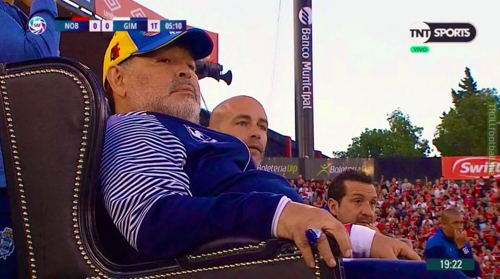 Diego Maradona coaching his latest game from a throne