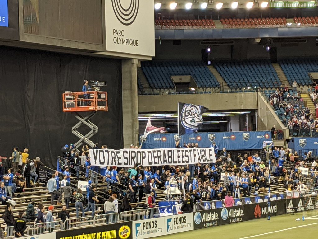 Montreal Impact banner vs. New England Revolution. Translation "your maple syrup is weak"