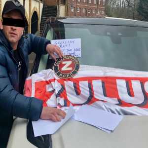 A Birmingham City fan has gone to the location of the Jack Grealish crash and stuck a Zulu Warriors and BCFC flag on top of the actual damaged car