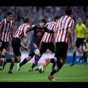 Messi walks through Athletic Bilbao's defence to score a goal