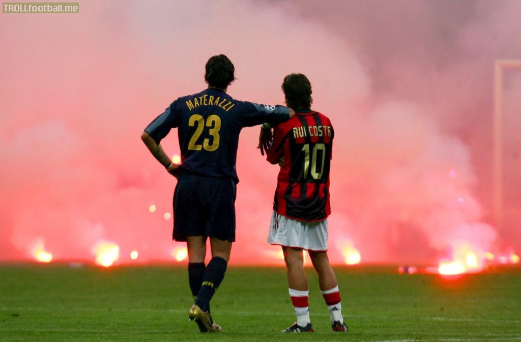 On this day 15 years ago, one of the most iconic photos in football was captured: Marco Materazzi and Rui Costa watching the fireworks and flares land onto the San Siro during the CL Quarter Finals.