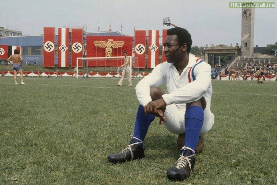 Pelé takes a break during the filming of Escape to Victory – in the stadium of a Jewish team filled with Nazi flags in a Communist country in 1981 [600x900] (from r/HistoryPorn)