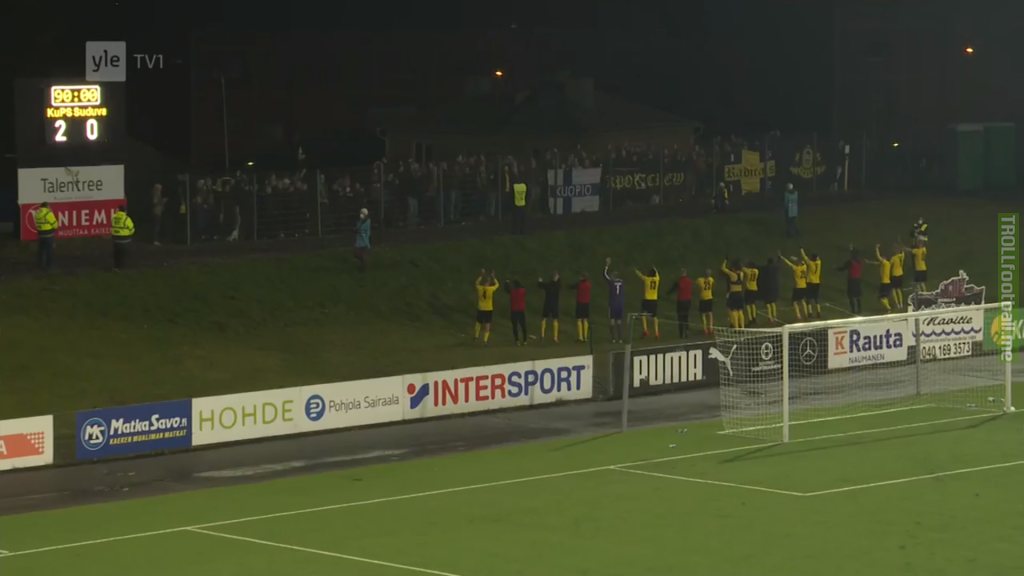 Finnish team KuPS Kuopio celebrating Europa League qualifier win with their supporters. As the stadium upgrades have not progressed, the supporters could see the match in person and were only separated by a simple metal fence.