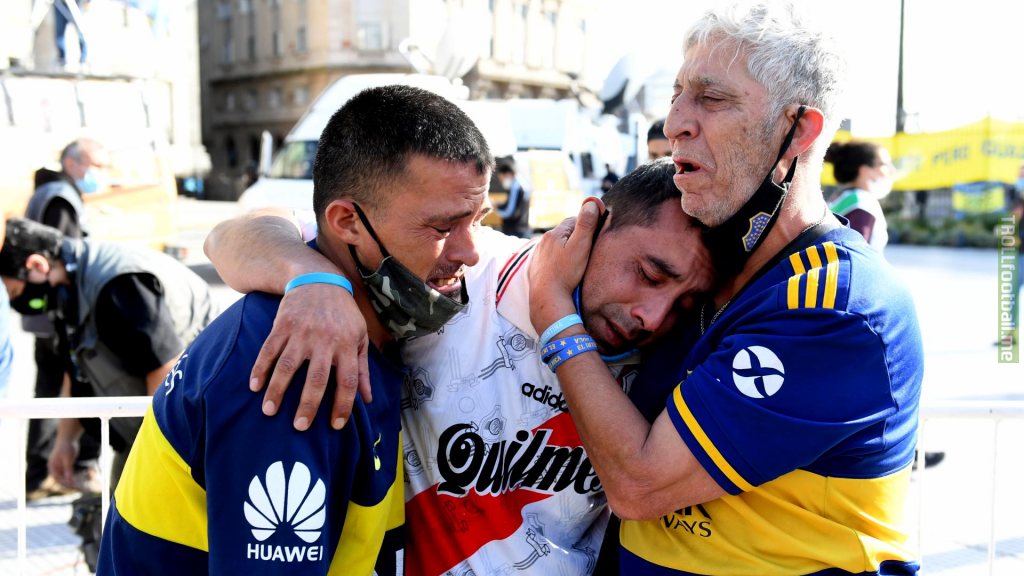 Fans of Boca Juniors and River Plate mourning the loss of Diego Armando Maradona in his funeral