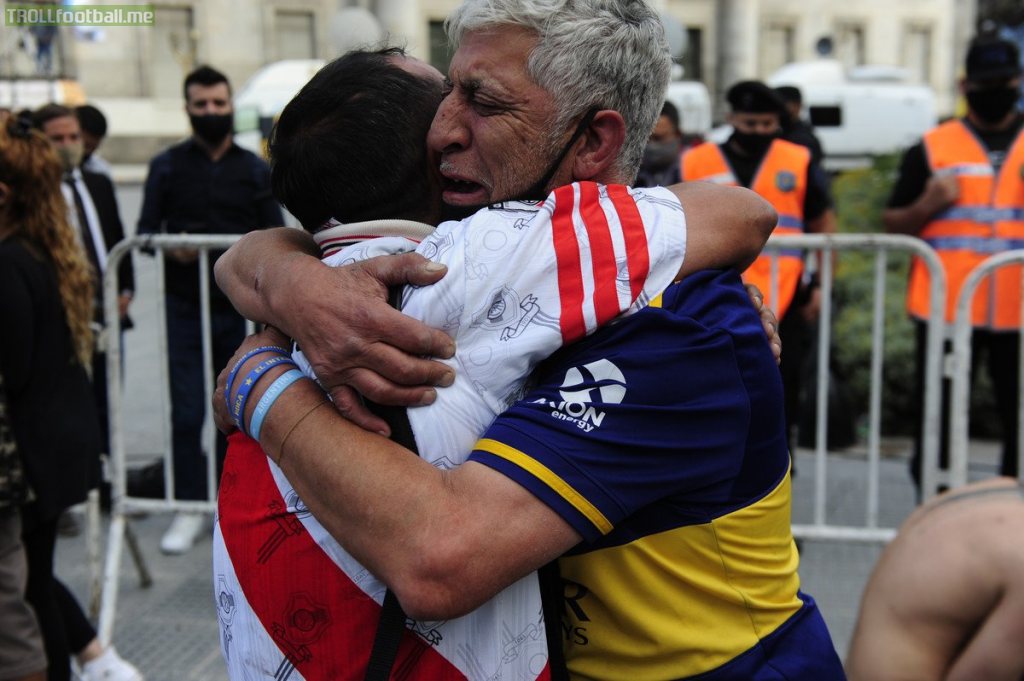 River Plate and Boca Juniors fans hugs while crying for Diego Maradona's death