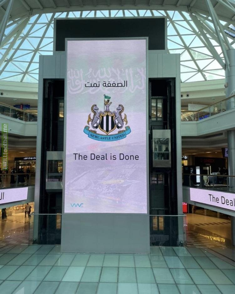 Saudi flag sticking out of the Newcastle crest at the Red Sea Mall in Jeddah, SA. “Completely separate from the Kingdom of Saudi Arabia” lol