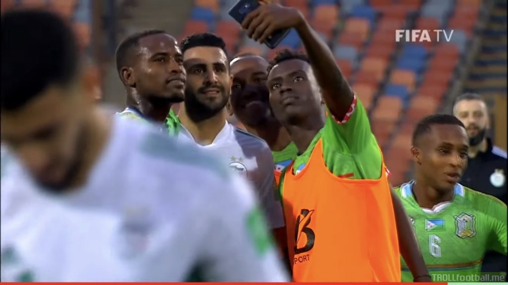 Djibouti players taking a selfie with Mahrez after their WC qualifiers game