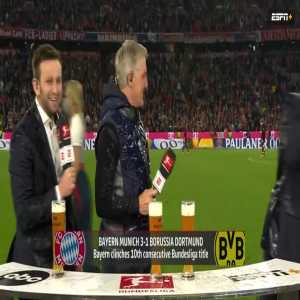 Thomas Müller soaking Schweinsteiger and the ESPN crew in beer after winning the Bundesliga