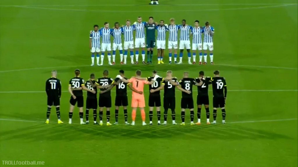 James McClean stands aside during moment of silence for the Queen at Huddersfield vs Wigan