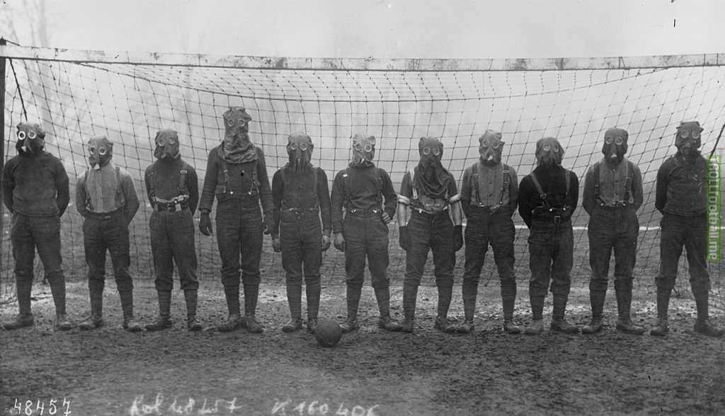 Football team of British soldiers with gas masks, Western front, 1916.
