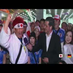 Japanese fans celebrate their victory against Germany