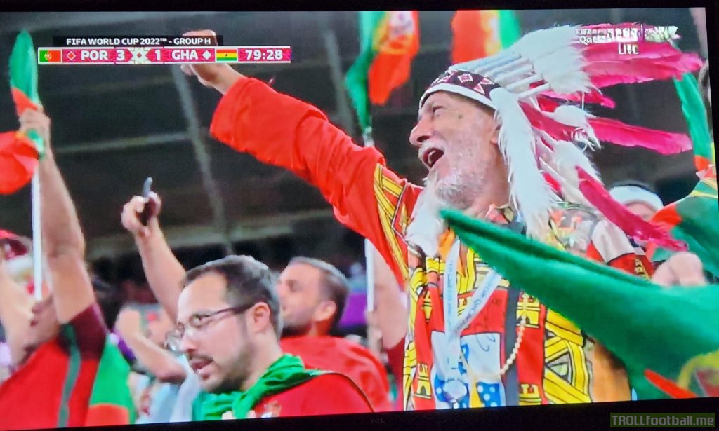 What is this Portuguese fan wearing?