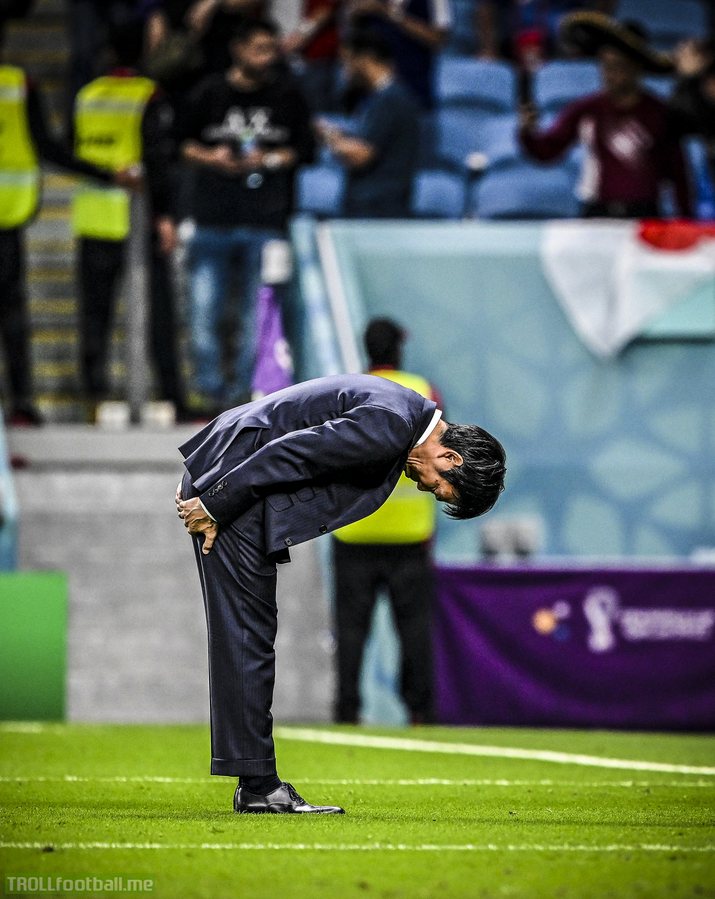 Japan manager Hajime Moriyasu bows to the fans to thank them for their support