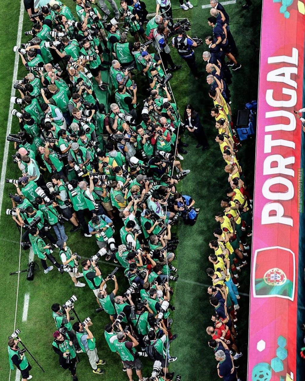 Photographers in front of the Portuguese bench during the anthem in the game against Switzerland.