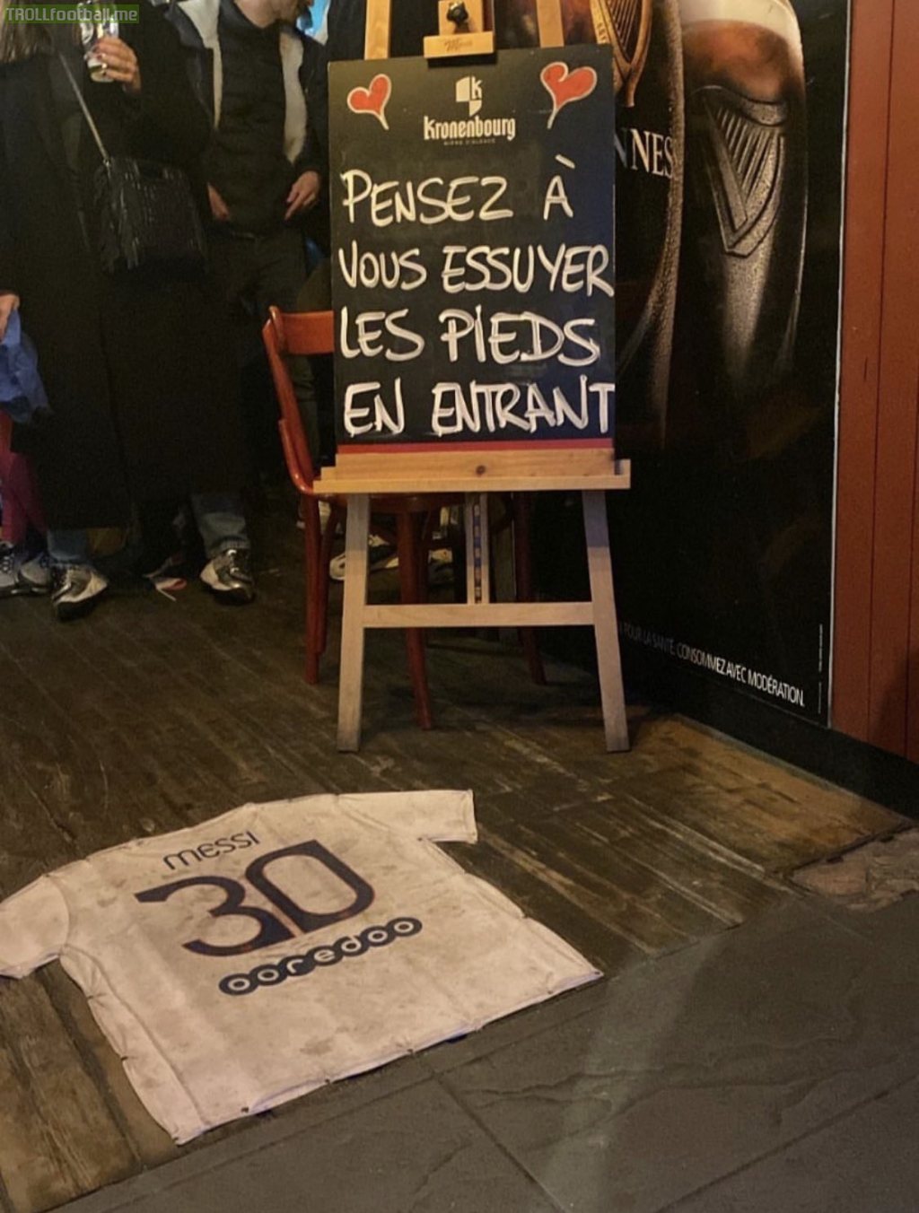 The entrance of a bar in France, "Remember to wipe your feet when you enter."