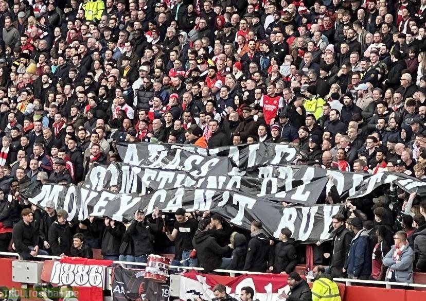 A banner reading “Arsenal FC - Class and Tradition. Something OIL money can’t buy” pictured at the Emirates Stadium today