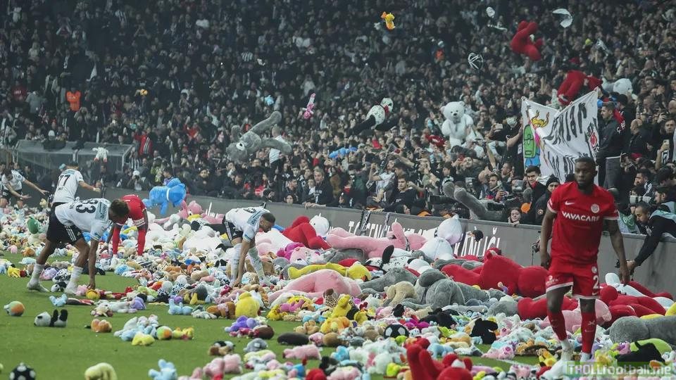 Fans of Besiktas Istanbul flood the football pitch with stuffed animals to protest against Erdogan