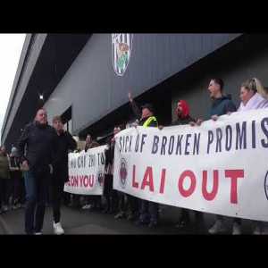 'Lai out': Thousands of West Brom fans hold protest march against club owner Guochuan Lai over unpaid loans